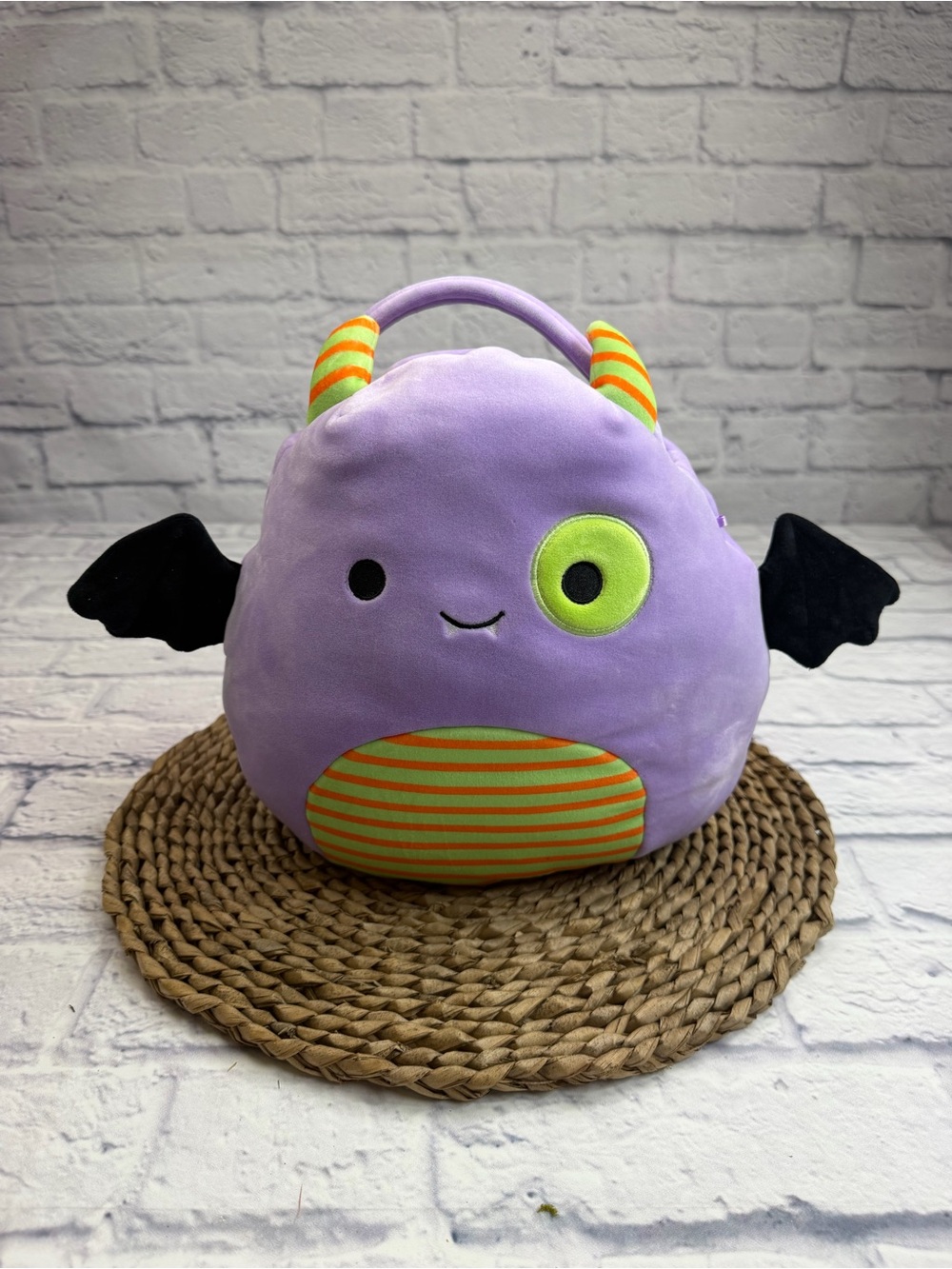 Squishmallows Lilac Monster Plush Bag with Neon Green Eye and Orange Stripes